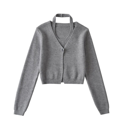 Stylish knitwear vest in a classic black or neutral colour, featuring a V-neck collar and long sleeves for a polished, versatile look.