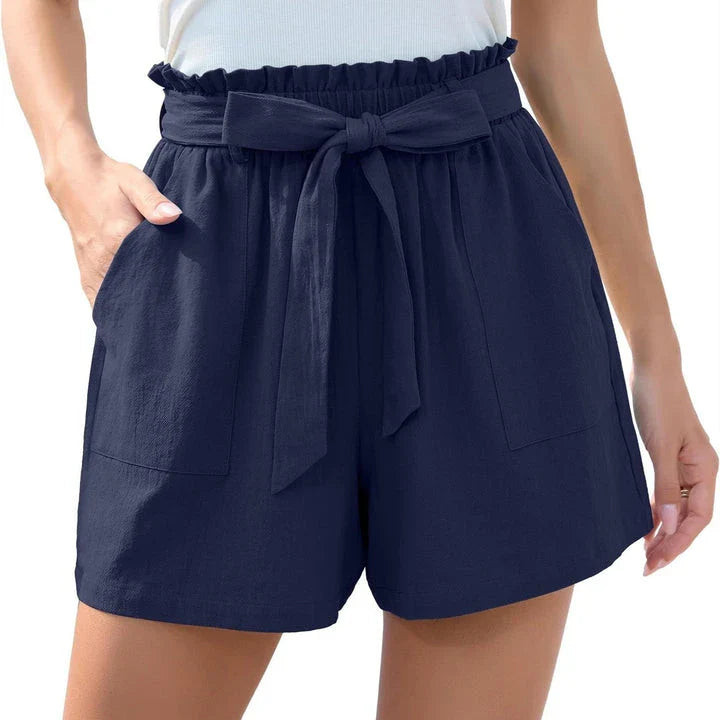 Stylish high-waisted ruffle bow shorts in black, perfect for Kiwi summer beach and casual wear