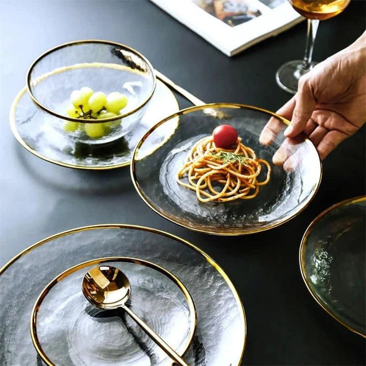 Elegant glass plates with a shimmering gold rim, perfect for formal dinners or casual meals.