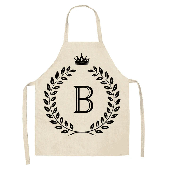 A crown and letter printed kitchen apron made of high-quality cotton and linen, suitable for both men and women in New Zealand kitchens.
