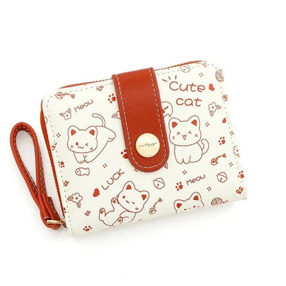 A stylish compact wallet featuring a playful cat-themed design with a tilted head motif, available in a range of candy-inspired colours.