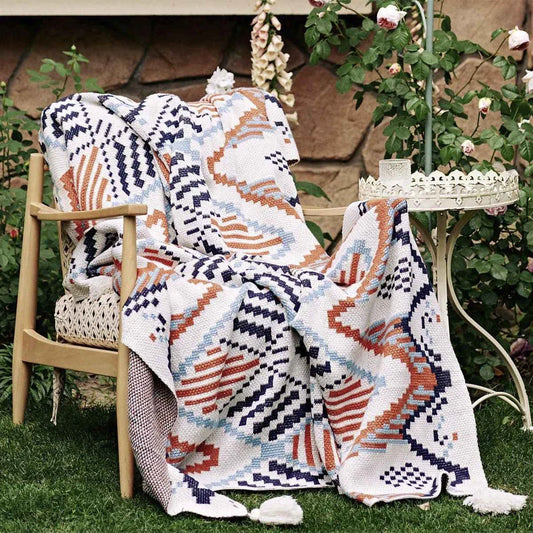 Cozy boho geometric cotton blanket in multicolor design, perfect for adding style and comfort to Kiwi homes and outdoor spaces