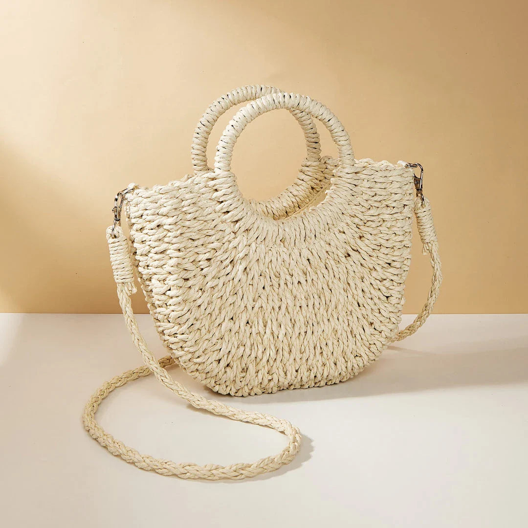 Stylish and eco-friendly straw woven beach bag for Kiwi women, featuring a unique half-moon shape, premium paper straw, and cotton lining.