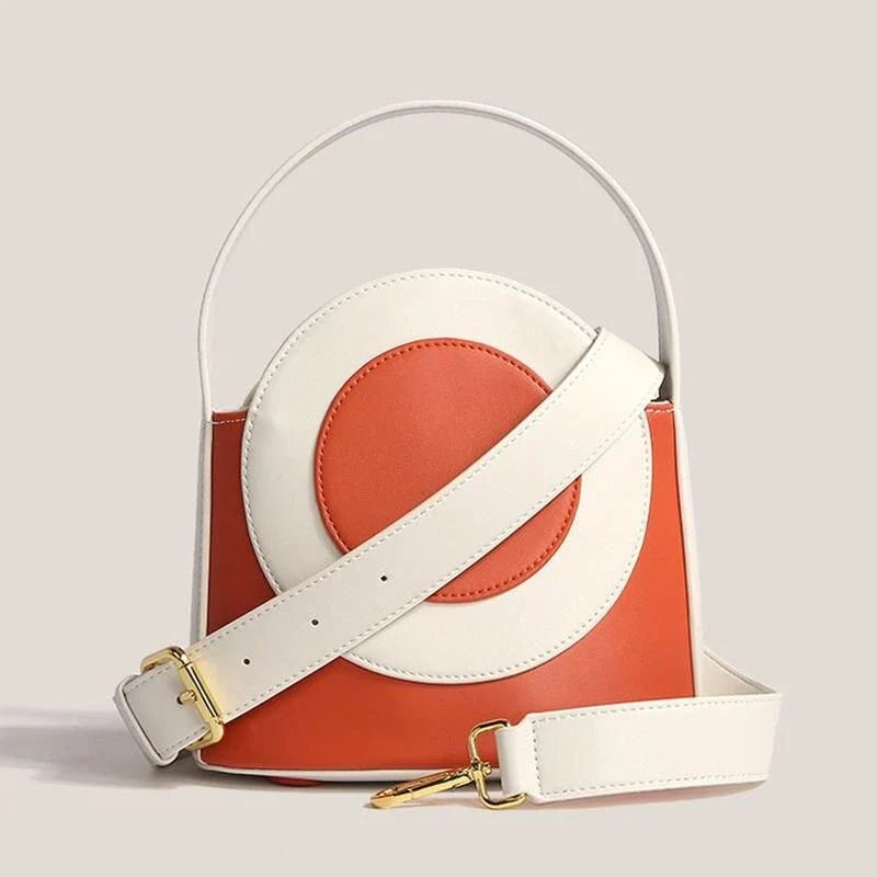 Stylish Kiwi vegan leather bucket bag with a unique colour block design, featuring adjustable straps and interior pockets