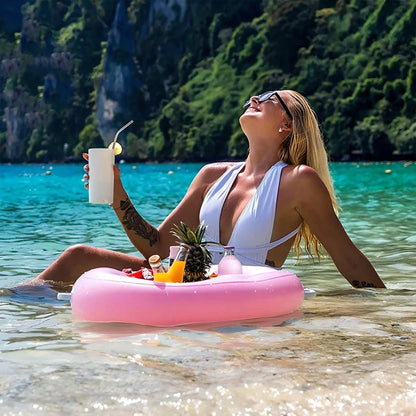 Inflatable drink holder with multiple compartments for cans, bottles, and snacks, designed for easy use in pools, at the beach, and other summer activities.