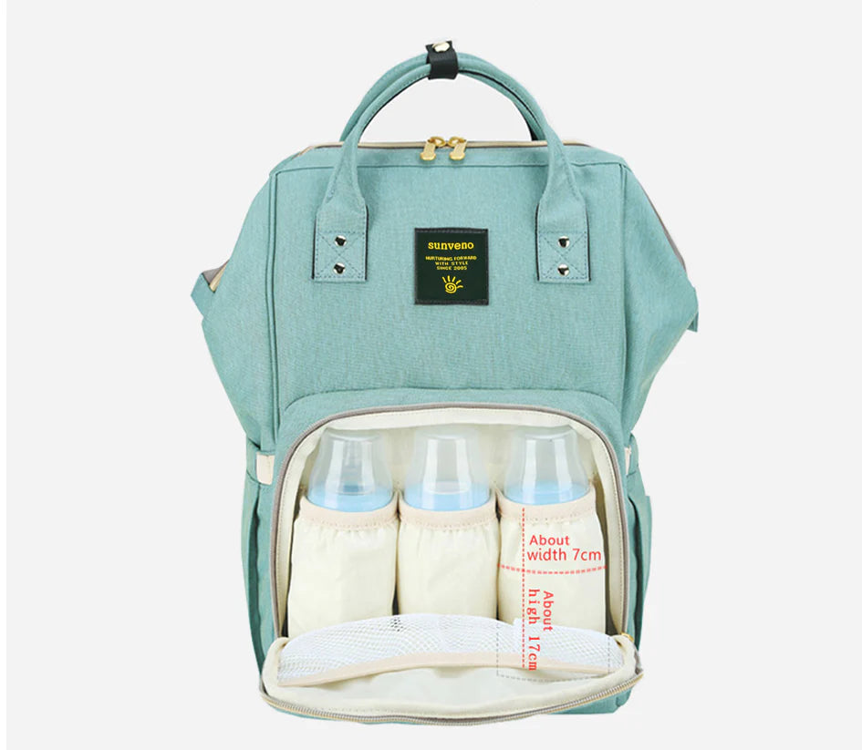 Stylish and practical mummy bag with reinforced handles, durable buckles, and separate bottling area for Kiwi mums