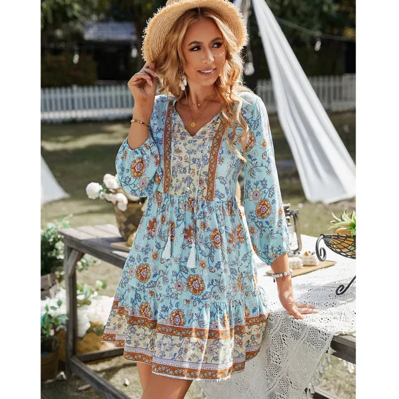 Stylish bohemian mini dress with geometric print, featuring a v-neck, three-quarter sleeves, and a flattering A-line silhouette.