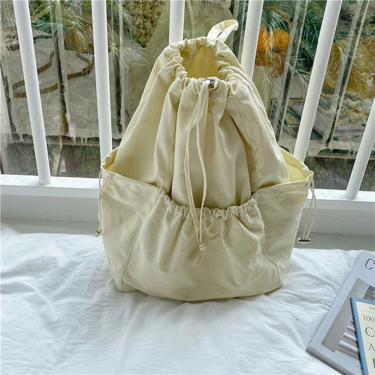 A stylish drawstring bucket bag made of premium polyester fabric, available in a variety of on-trend colours to complement your New Zealand fashion