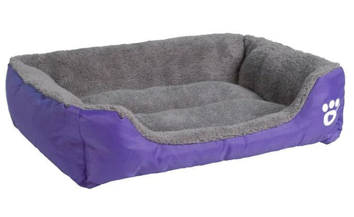 A cozy, waterproof pet bed featuring a soft fleece lining and paw print design, perfect for providing comfort and support for your beloved companion.