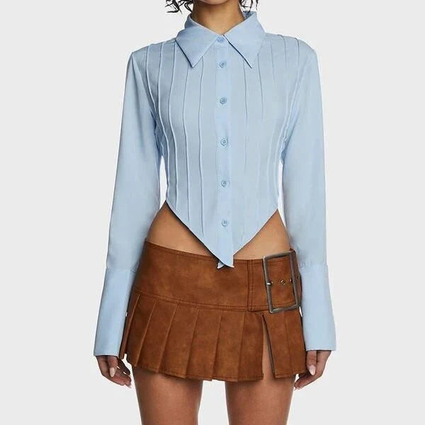 Stylish blue blouse with lace-up back and V-shaped hem, a versatile wardrobe staple with a touch of modern elegance.