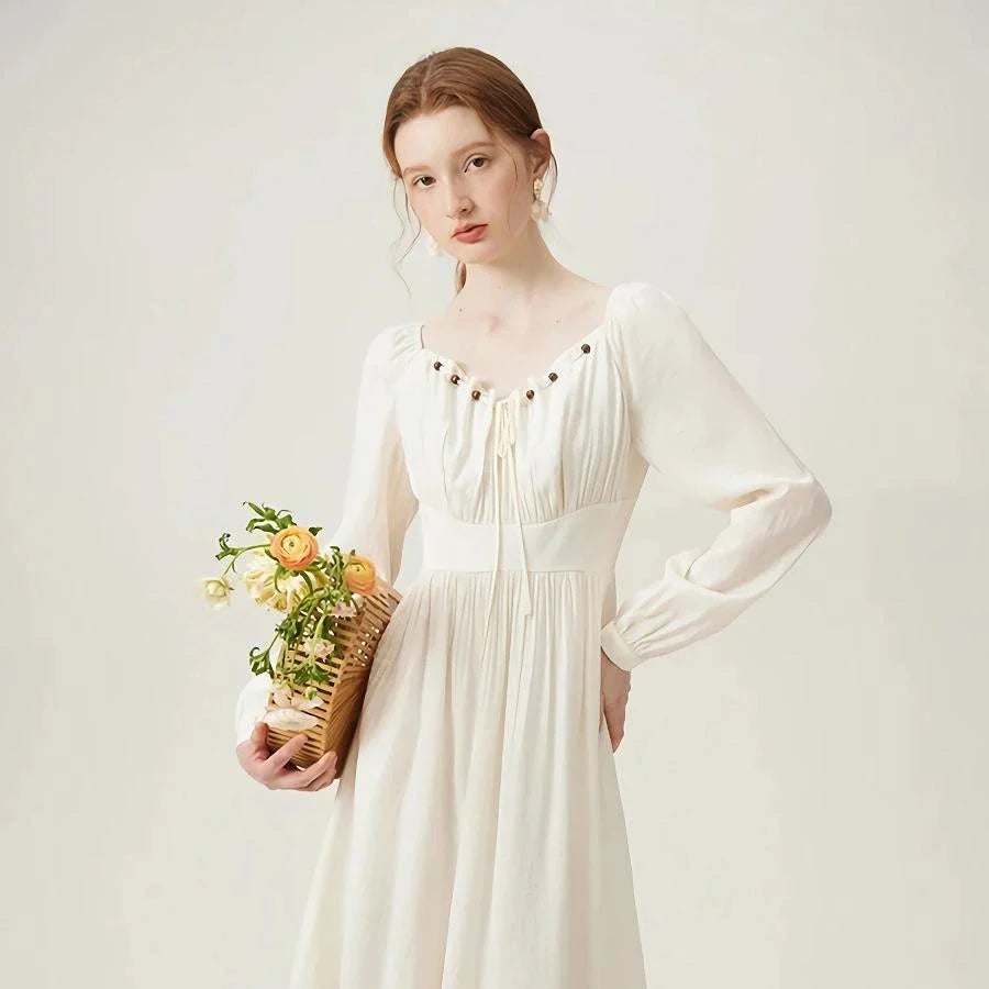 Elegant Kiwi-Inspired Romantic Dress with full-length sleeves, empire waistline, and A-line silhouette