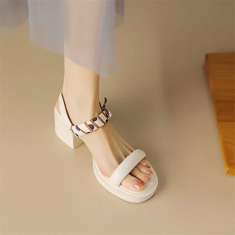 Chic open-toe leather platform sandals with adjustable buckle strap and square heel, perfect for Kiwi summer style.