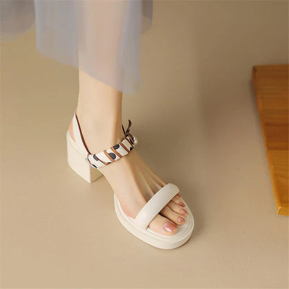 Chic open-toe leather platform sandals with adjustable buckle strap and square heel, perfect for Kiwi summer style.