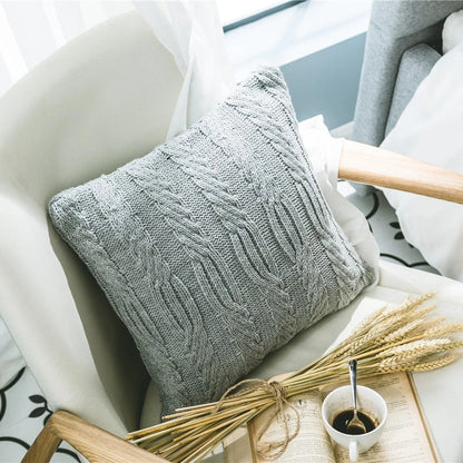 Elegant grey knitted decorative pillow case with intricate jacquard pattern and embroidered stripes