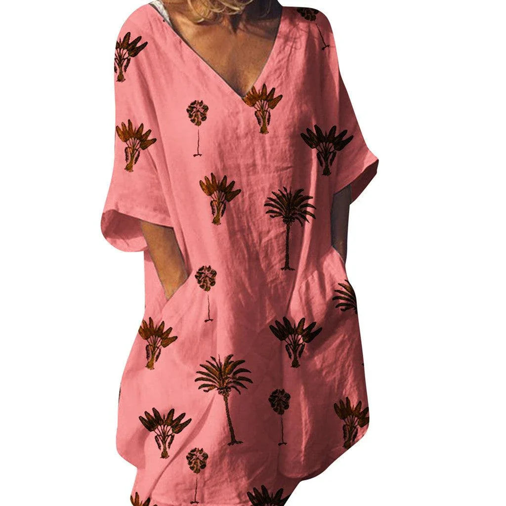 Vibrant leaf print casual dress with V-neck and flared silhouette, perfect for the Kiwi lifestyle