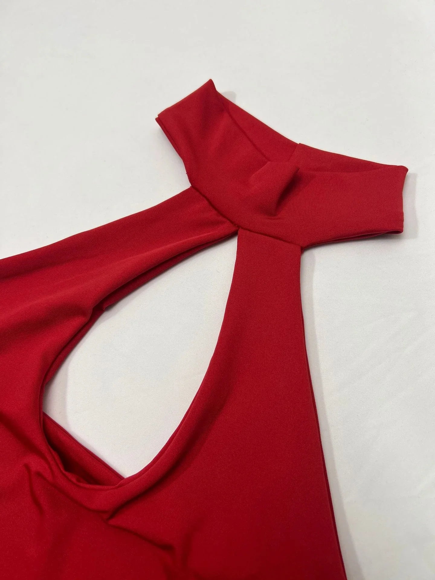 A stylish backless halter dress with trendy cut-outs, perfect for the Kiwi summer season.