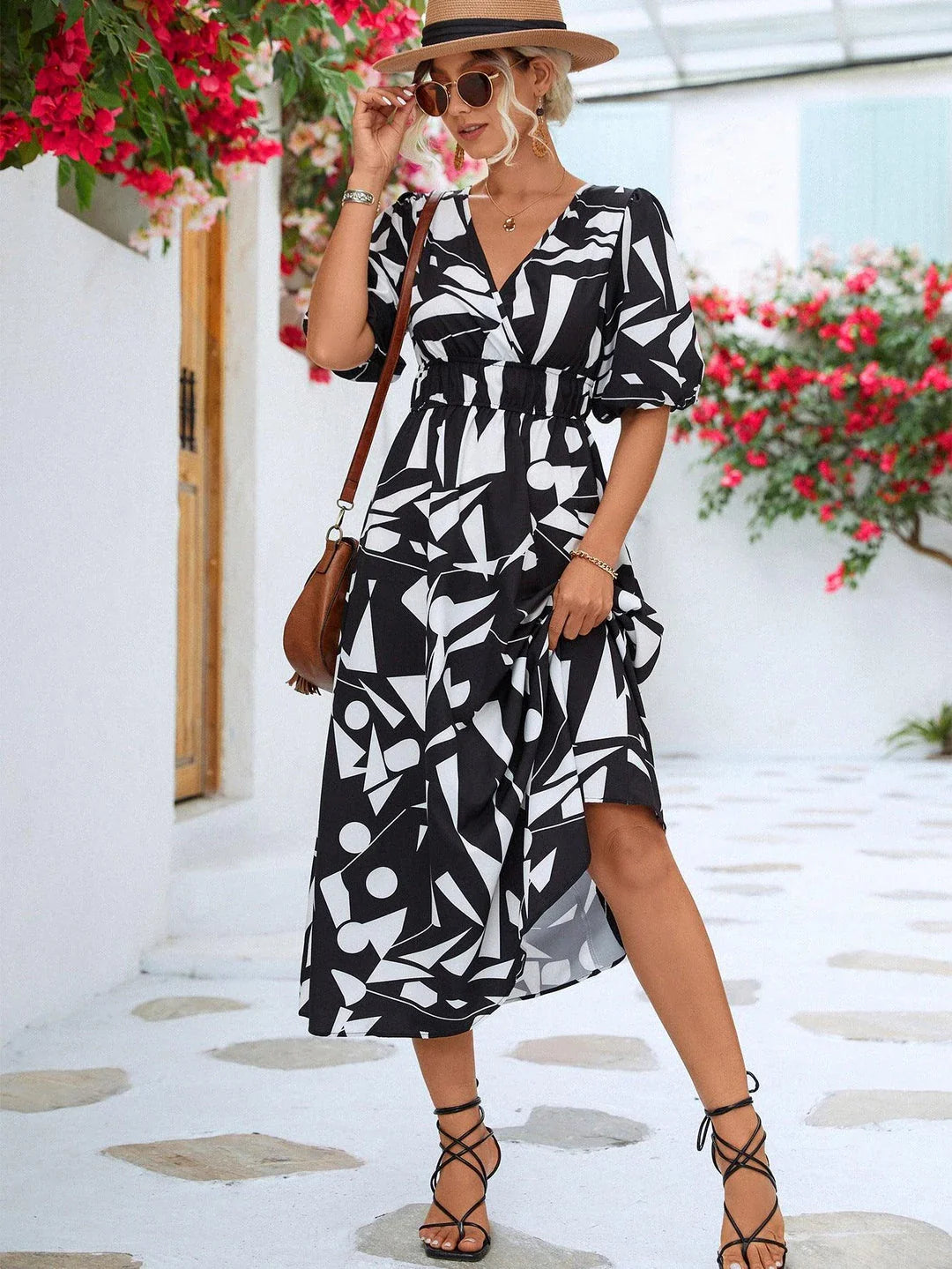 A stylish puff-sleeve dress with a printed surplice neckline, perfect for casual and dressy occasions.