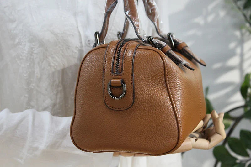 Classic leather shoulder bag in brown with a soft, pillowy shape and cotton lining for ultimate comfort and style