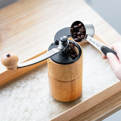 Elegant wooden manual coffee grinder with premium steel conical burr for consistent grinding and optimal coffee flavour.