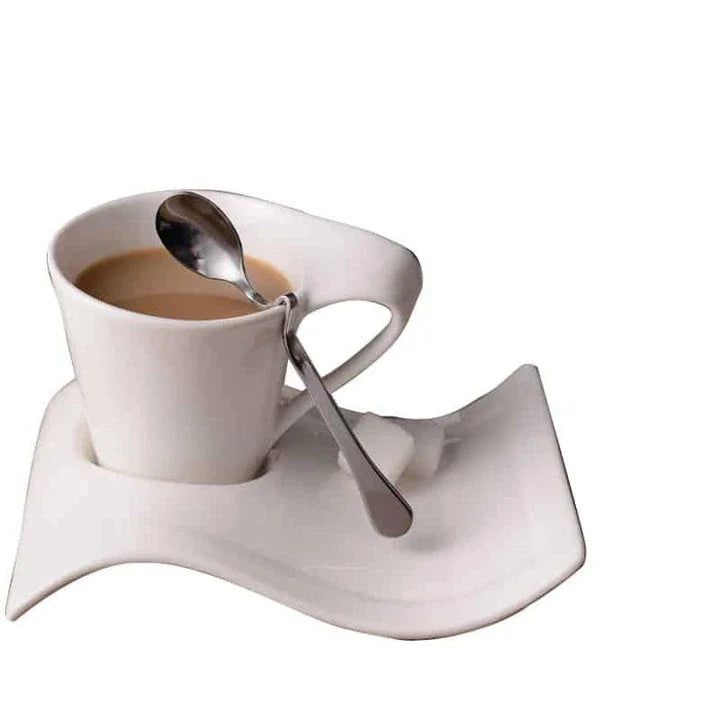 Stylish wavy ceramic coffee mug with matching saucer, available in various sizes and materials, designed in New Zealand for an elevated coffee experience.