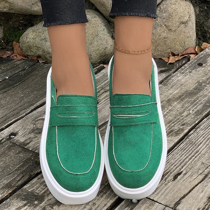 Women's casual platform loafers with a round toe design, slip-on construction, and a durable rubber sole for everyday comfort and style.