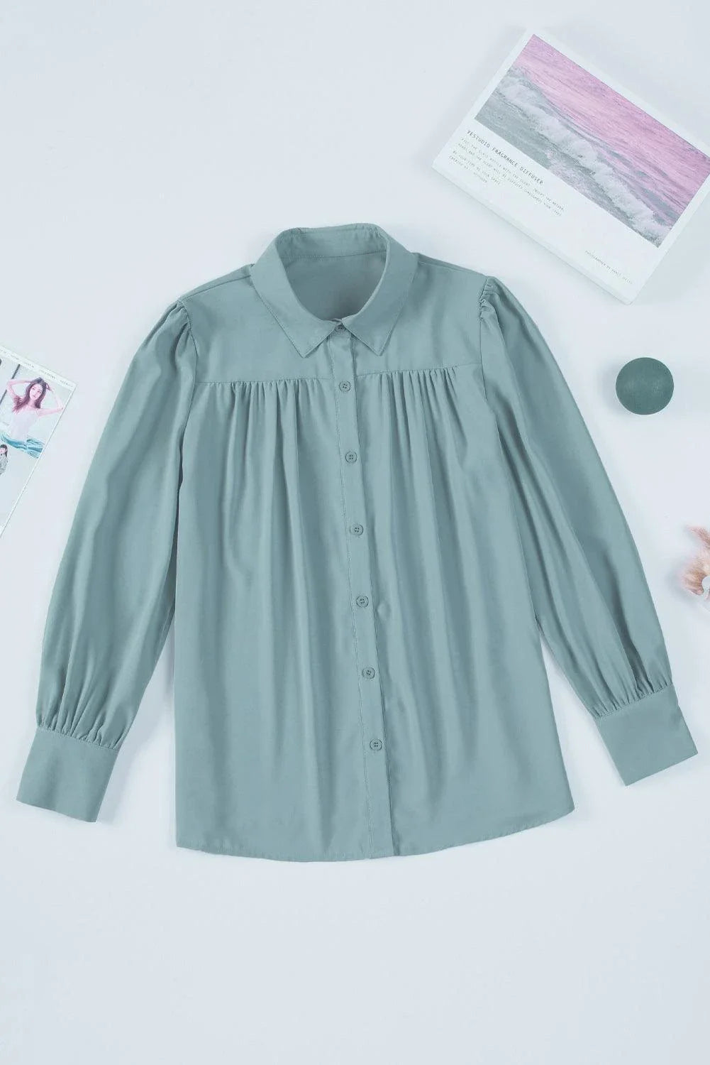 Gathered Detail Puff Sleeve Shirt in blue, featuring a collared neckline, buttoned front, and distinct puff sleeves for a timeless Kiwi style.