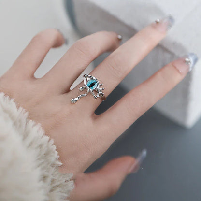 A stylish silver ring featuring a cat-eye design with a devilish twist, perfect for adding a touch of playful elegance to any Kiwi girl's look.