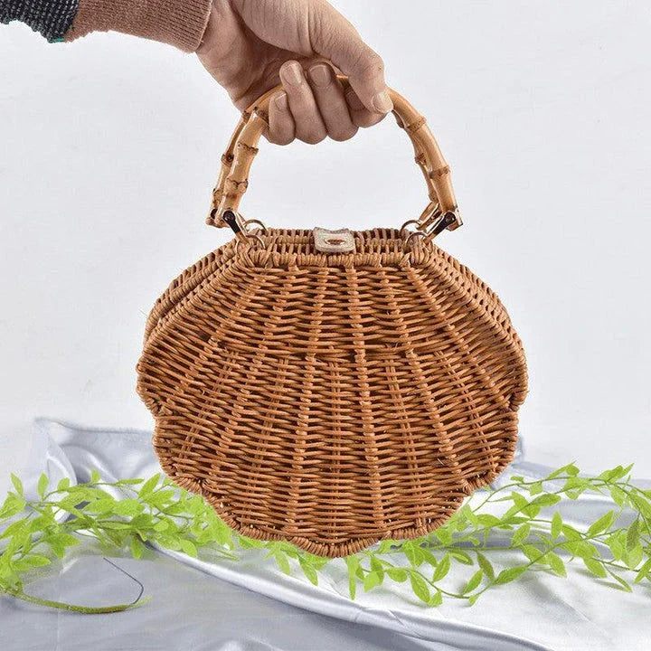 Rattan straw bag with intricate three-dimensional conch shell design, ideal for everyday use and a touch of coastal chic