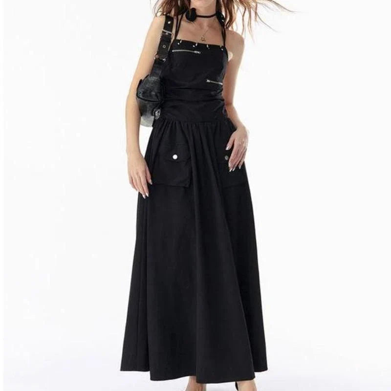 Elegant black backless maxi dress with pockets, perfect for formal events or casual outings.