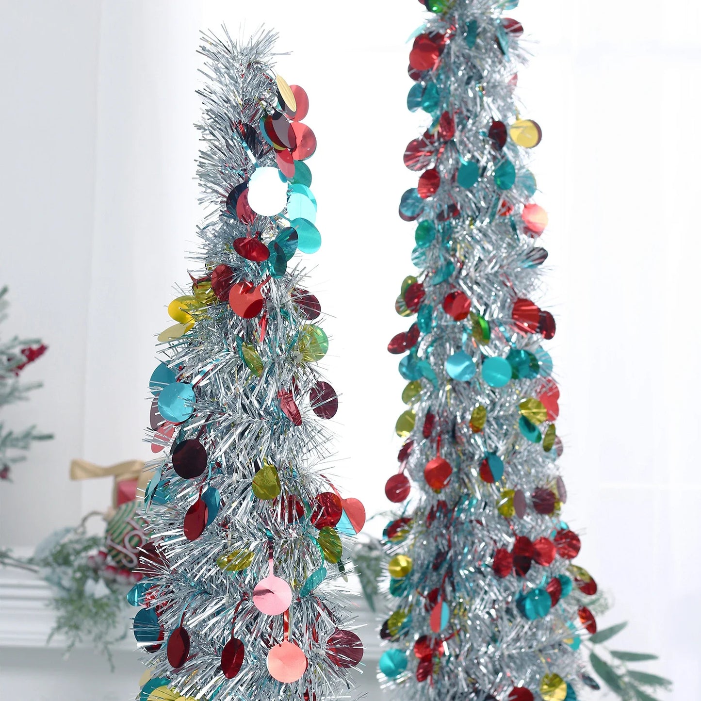 A collapsible and decorative Christmas tree in festive colors, designed for small spaces in New Zealand homes.