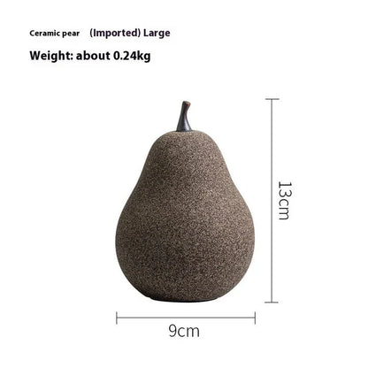 Handcrafted ceramic pear decoration with a sleek, modern design, perfect for adding a touch of natural elegance to any Kiwi home