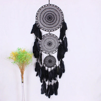 Vibrant, handcrafted dreamcatcher wall hanging with feathers, wood, and beads, adding a touch of Kiwi-inspired charm to any home.