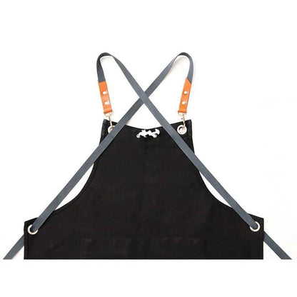 Black canvas barista apron with multiple pockets and adjustable straps, perfect for Kiwi café workers