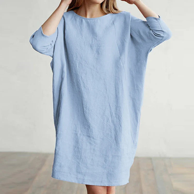 A cotton and linen dress with a round neckline, pockets, and an A-line silhouette in various colors.