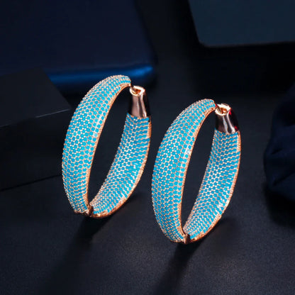 Elegant Blue Dream Ear Rings with a crown-inspired design and shimmering zircon stones