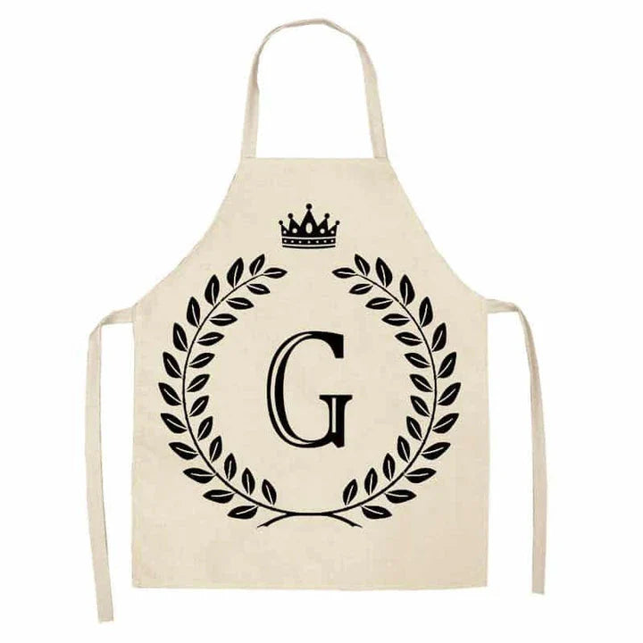 A crown and letter printed kitchen apron made of high-quality cotton and linen, suitable for both men and women in New Zealand kitchens.