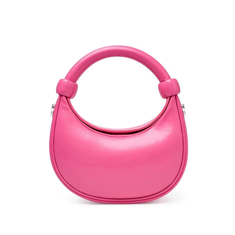 Rose Pink Leather Crescent Crossbody Bag with a unique half-moon design, showcasing premium craftsmanship and versatile functionality