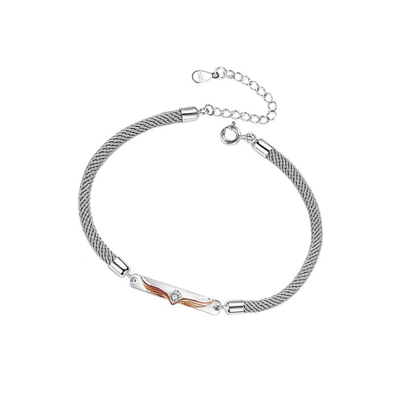 Sterling silver couple's bracelet with elegant angel wing design, adjustable size for both men and women