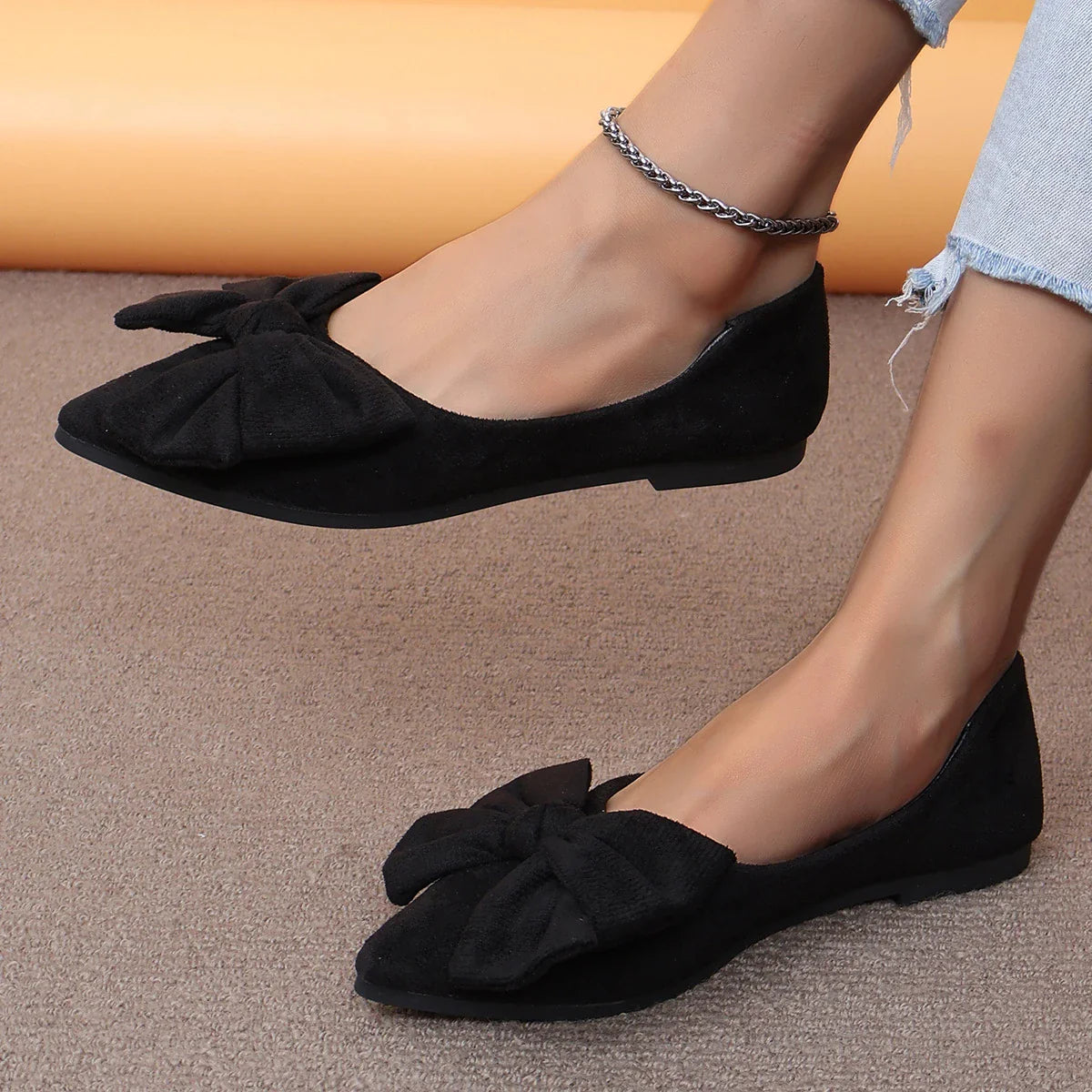 Stylish flat shoes with a pointed toe, low heel, and bow accent, designed for Kiwi women's casual and fashion-forward wardrobes.