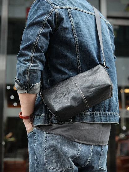 Stylish leather messenger bag with zipper closure and adjustable shoulder strap, perfect for Kiwi men's everyday carry