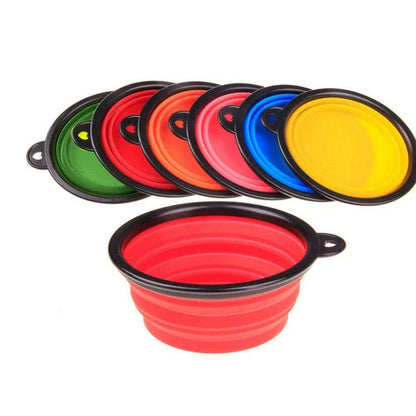 Foldable silicone dog bowl in red color, perfect for outdoor activities with Kiwi canine companions