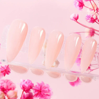 Handcrafted nude pink press-on nails with an almond shape, offering a minimalist and sophisticated style