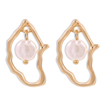 Irregular shaped pearl earrings made with sustainable alloy material, perfect for the free-spirited Kiwi