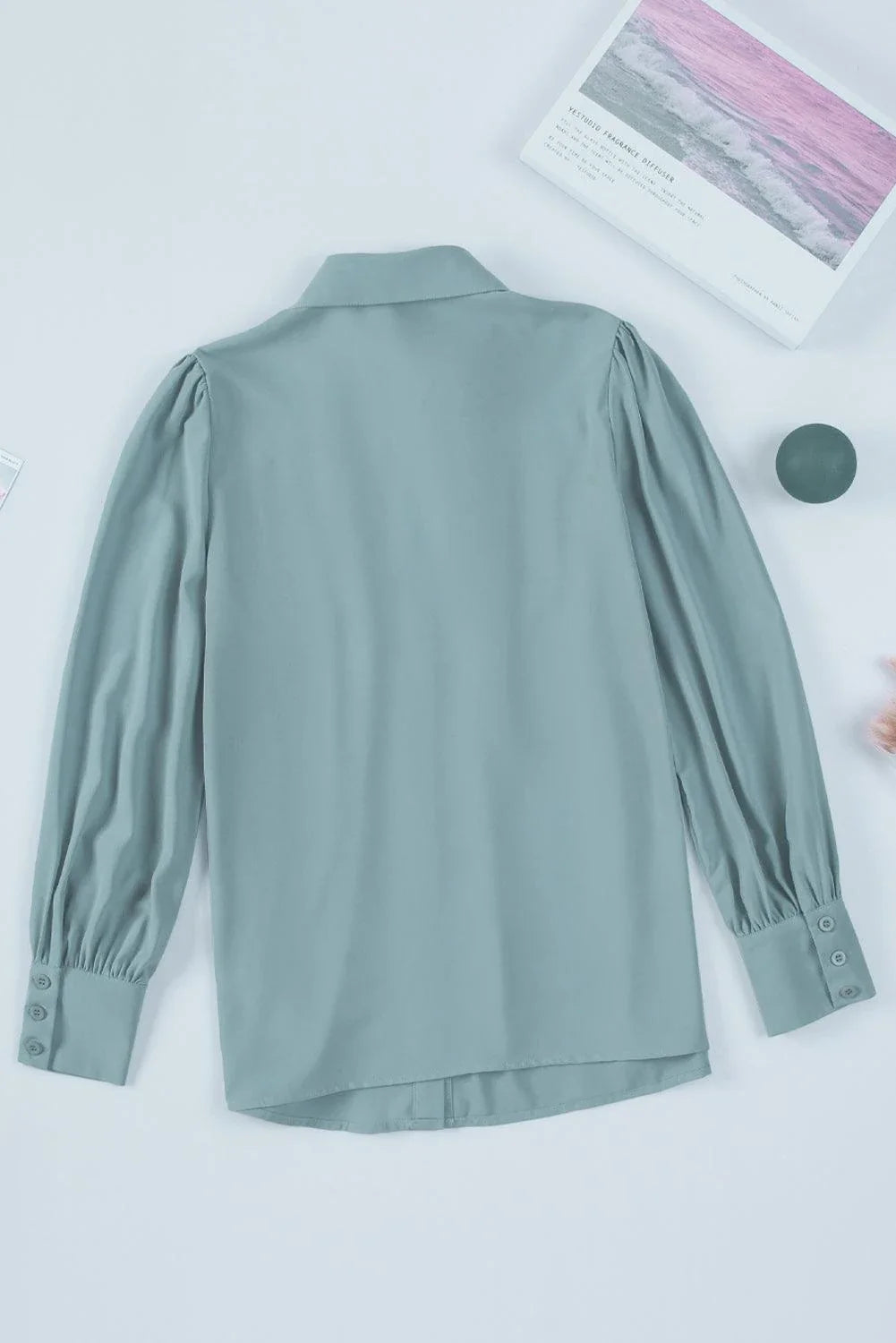 Gathered Detail Puff Sleeve Shirt in blue, featuring a collared neckline, buttoned front, and distinct puff sleeves for a timeless Kiwi style.