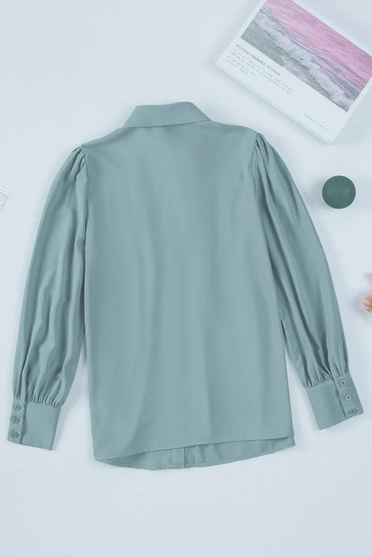 Gathered Detail Puff Sleeve Shirt in blue, featuring a collared neckline, buttoned front, and distinct puff sleeves for a timeless Kiwi style.