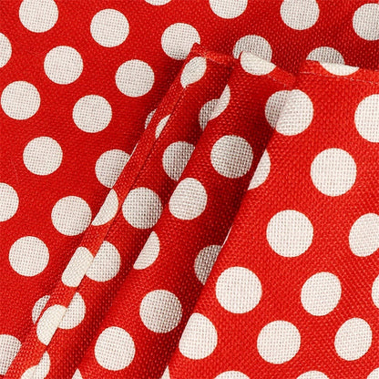 A cosy Christmas tree skirt in a classic red and white polka dot pattern, designed to fit a wide range of tree sizes and tidy up the base.