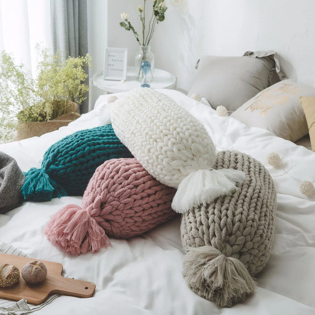 Cosy candy-shaped chunky knit pillow with adorable tassel design, perfect for adding a playful touch to your Kiwi home decor