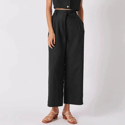 Elegant high-waist linen trousers with Korean-inspired design, featuring lace-up detail and button decorations for a sophisticated and comfortable look.