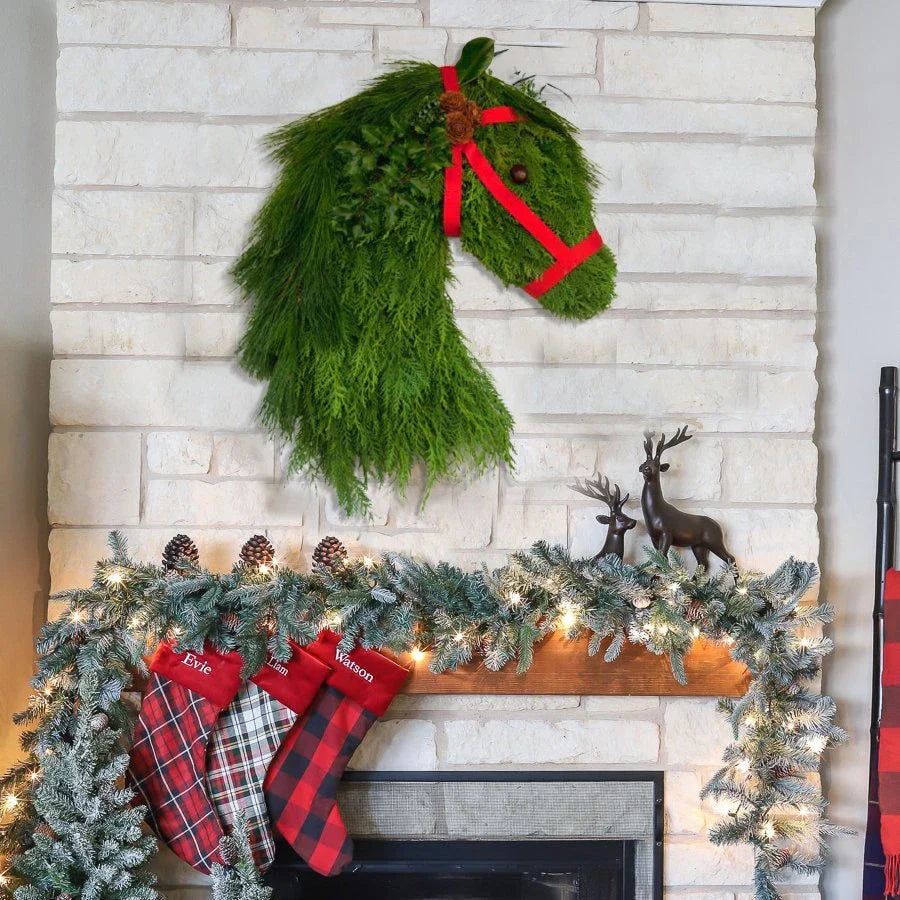 Rustic double horse head Christmas wreath with lifelike pine branches, a unique and charming Kiwi-inspired holiday decoration