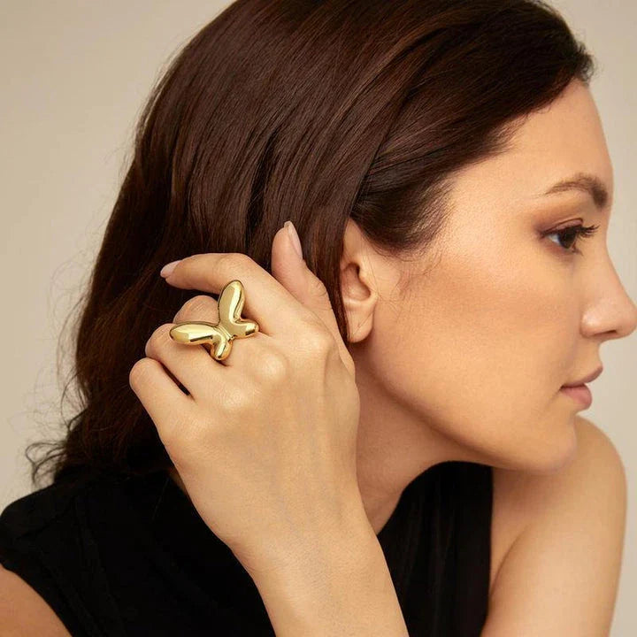 Elegant 18K gold-plated stainless steel butterfly ring with a whimsical open design, perfect for Kiwi celebrations and everyday wear.